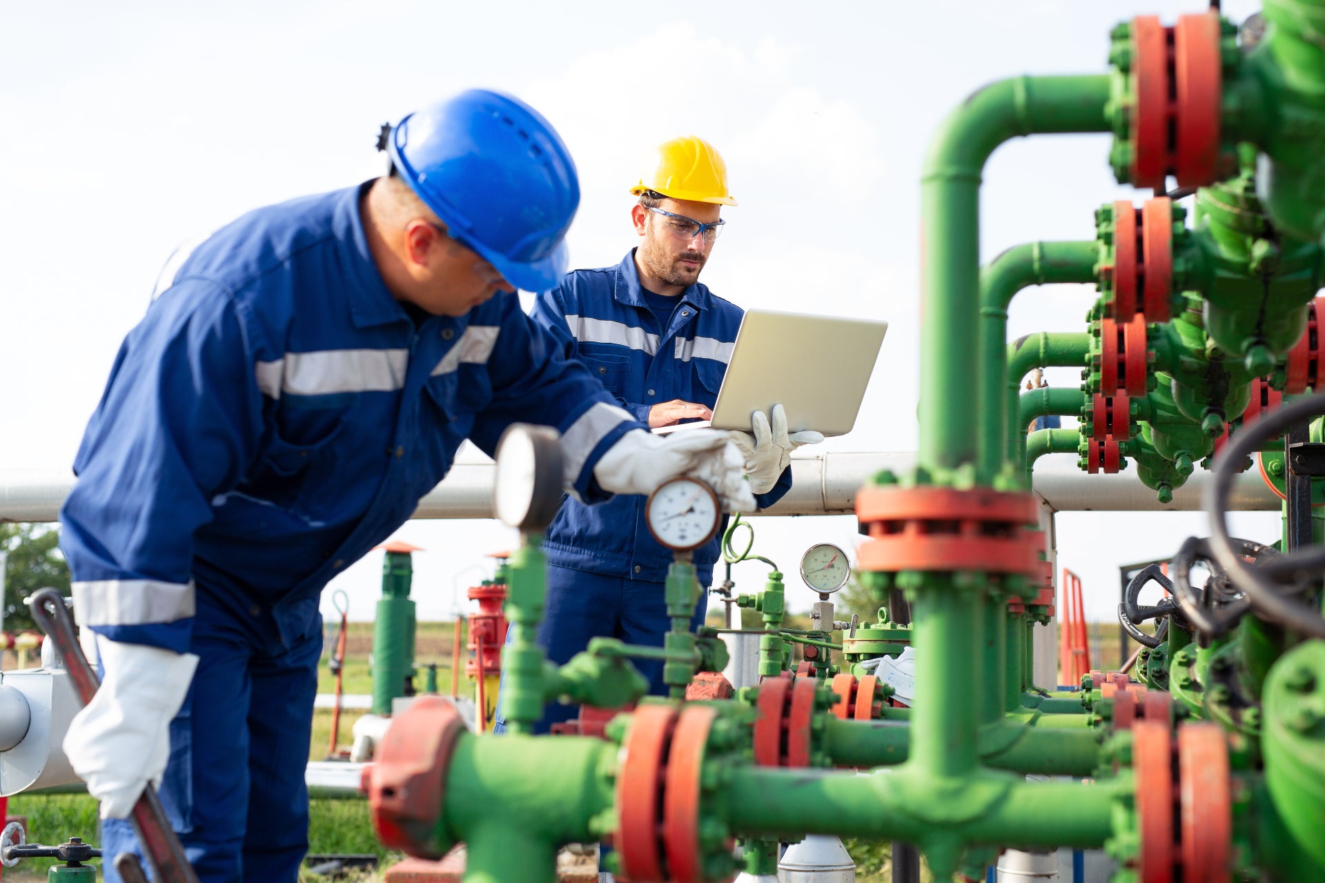 men work on pipes