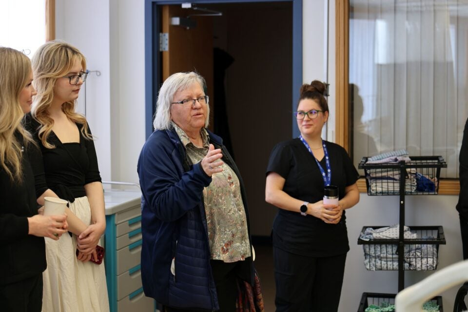 Angela De Smit chats with fellow health care workers