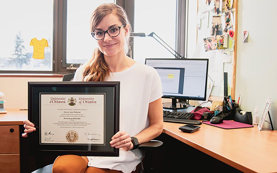 Wellstead holding framed PhD