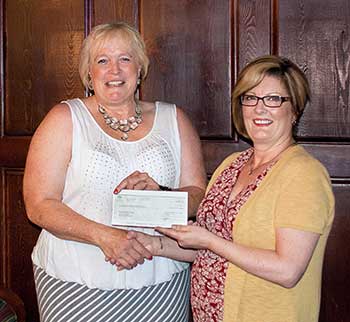 Laurey-Anne Roodenburg presentedDr. Loren Lovegreen with a cheque for $1,100
for a one-time bursary at NLC.