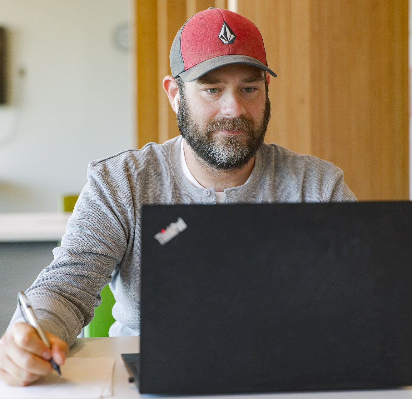 NLC Student on a laptop