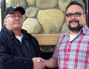 Melvin Cardinal (left) received the Encana Aboriginal
Student Award from Fort St. John Aboriginal
Student Advisor David Christie.
