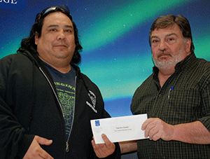 Paul O’Toole (right) presented the Dave Johnson Memorial Endowment to Patrick Cloutier.